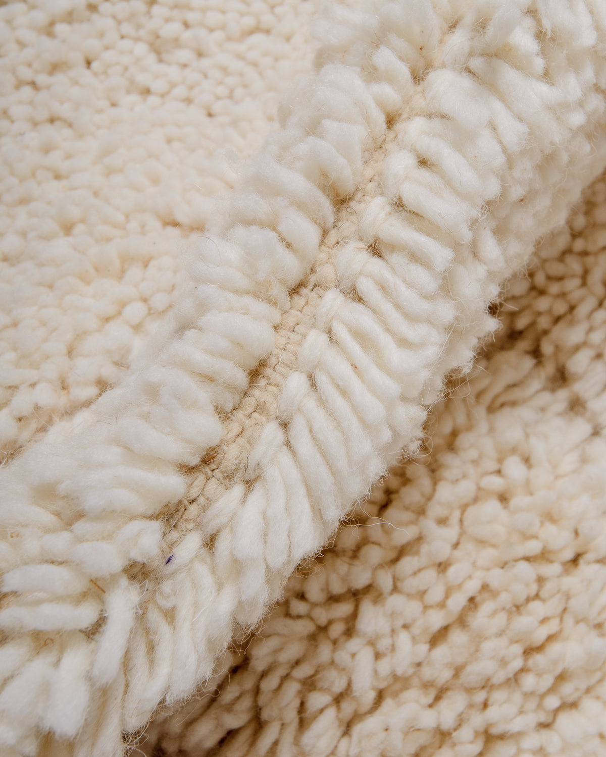 Modern, designer, handcrafted Berber rug from Morocco. Beniourain carpet with beautiful colours and patterns and fluffy wool texture.